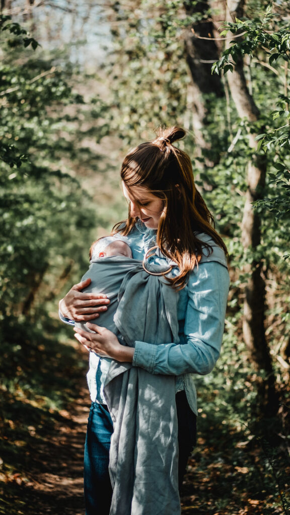 mom holding sleeping baby