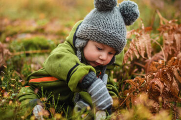 kid playing in nature